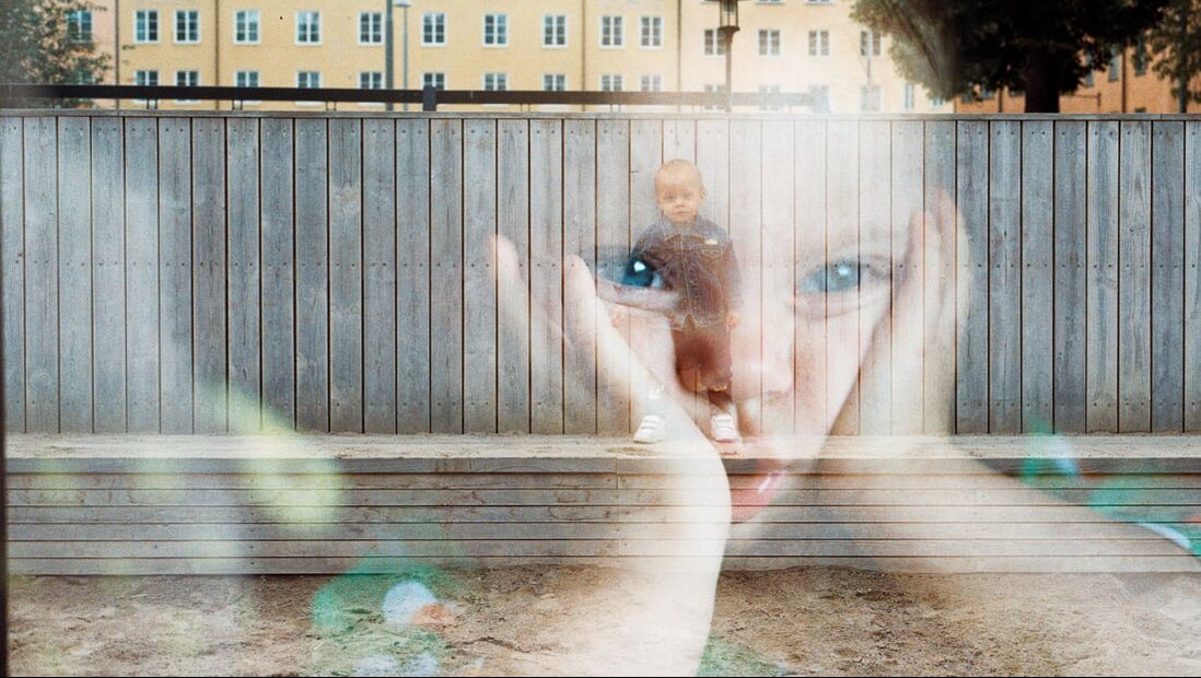 A photo of a sad child superimposed over a photo of a school